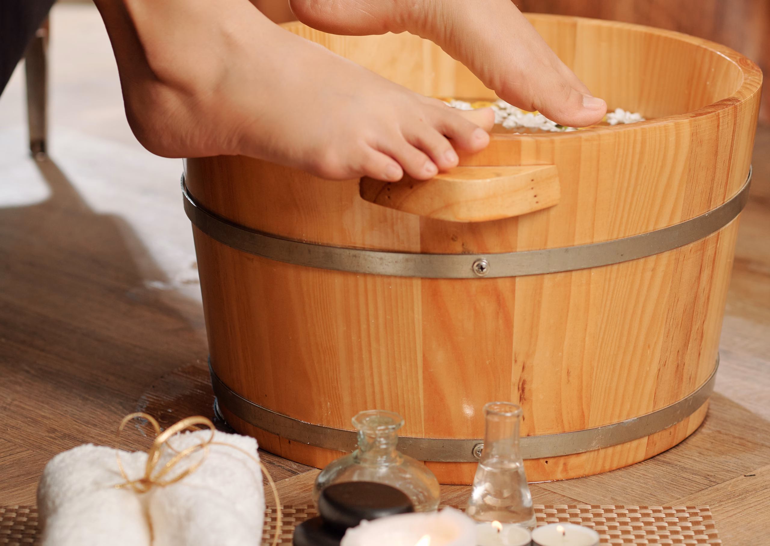 Woman putting feet in hot water